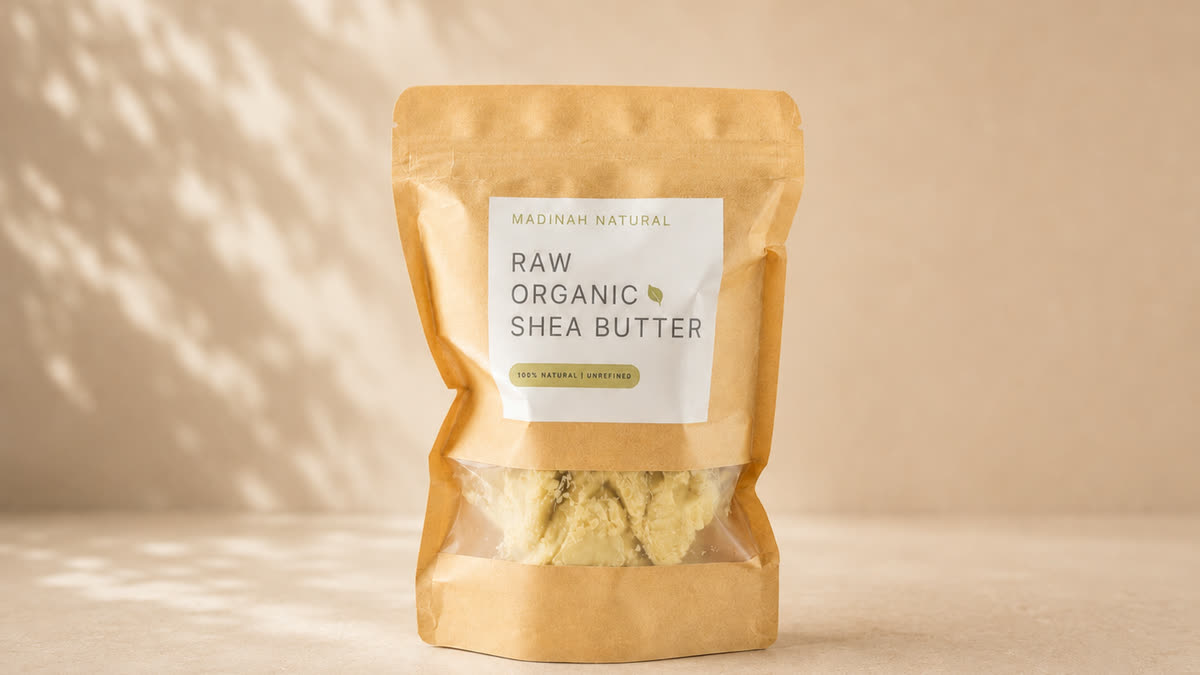 The Madinah Natural pouch of raw organic shea butter, the butter visible through the front window