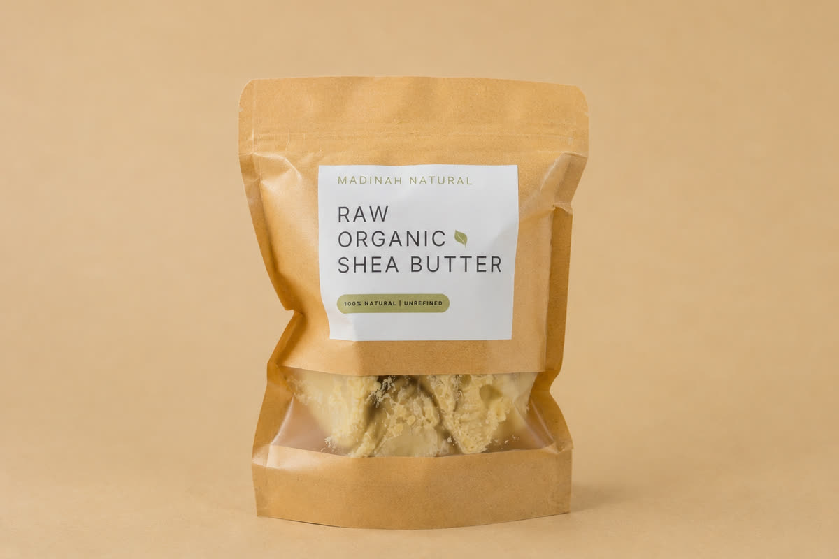 Kraft pouch of Madinah Natural raw organic shea butter, the butter visible through the front window