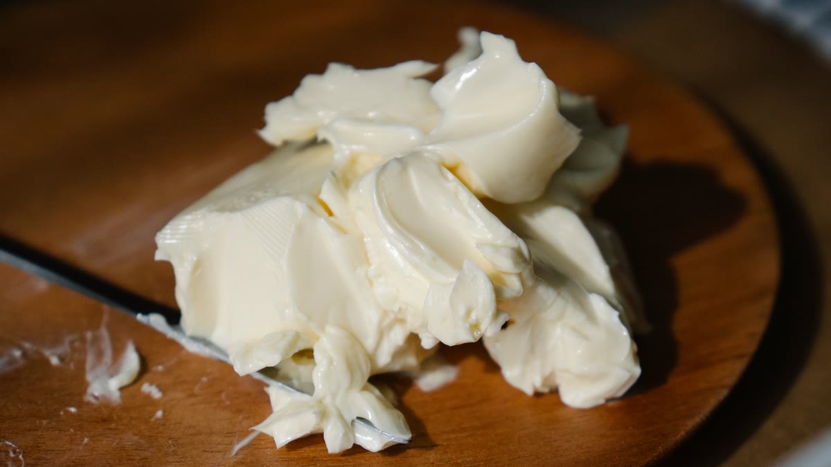 Shea butter beaten smooth and glossy, lifted on a spatula